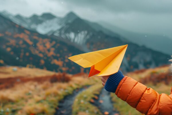 kid-playing-with-paper-plane